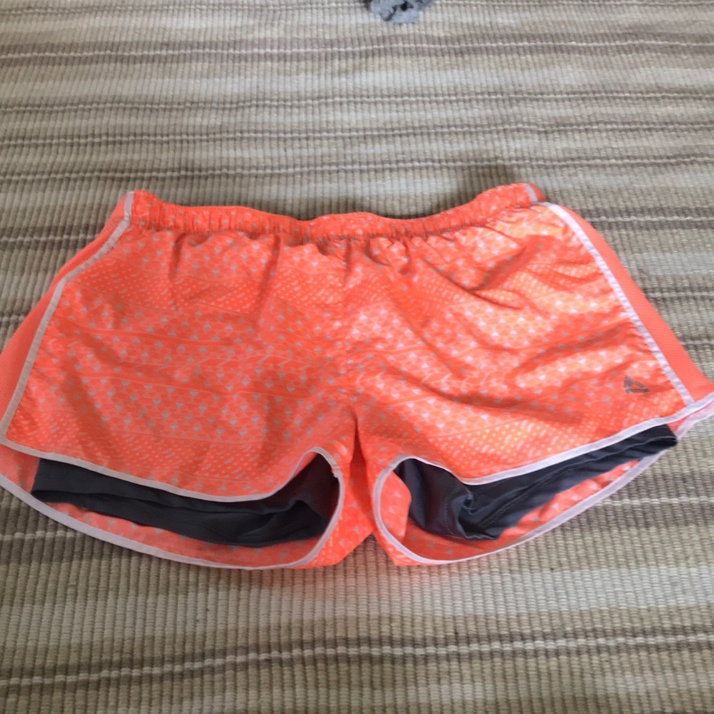 Three pairs of printed athletic shorts